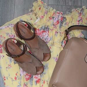 Yellow Maxi Dress with flower print on it.